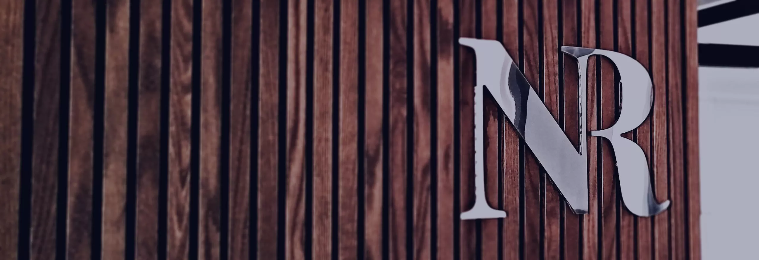 Nicos Rossos Insurance Brokers office sign.