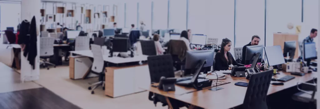 Office with employees at their desks.