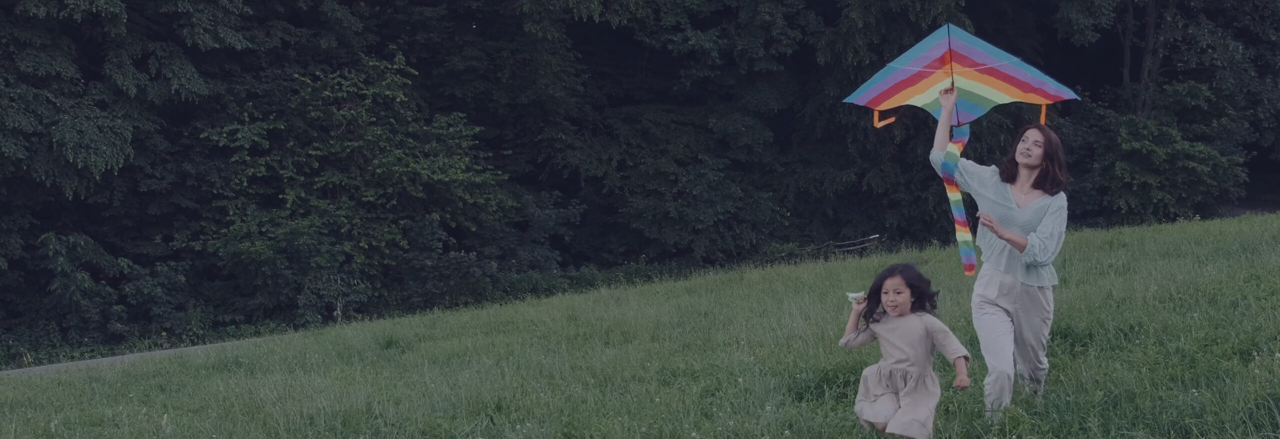 Mother and daughter with a kite.